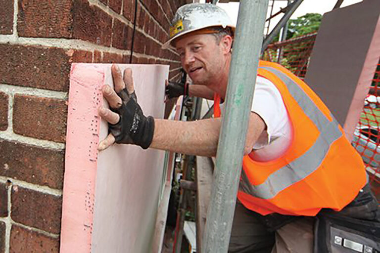 Generic workers Insulation bricks Green Deal retrofit scaffolding Thextons worker